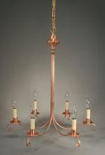 Copper-colored chandelier with six lights, hanging against a gray background.