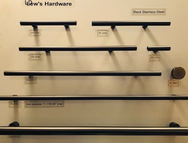 Display of black stainless steel cabinet pulls in various sizes.