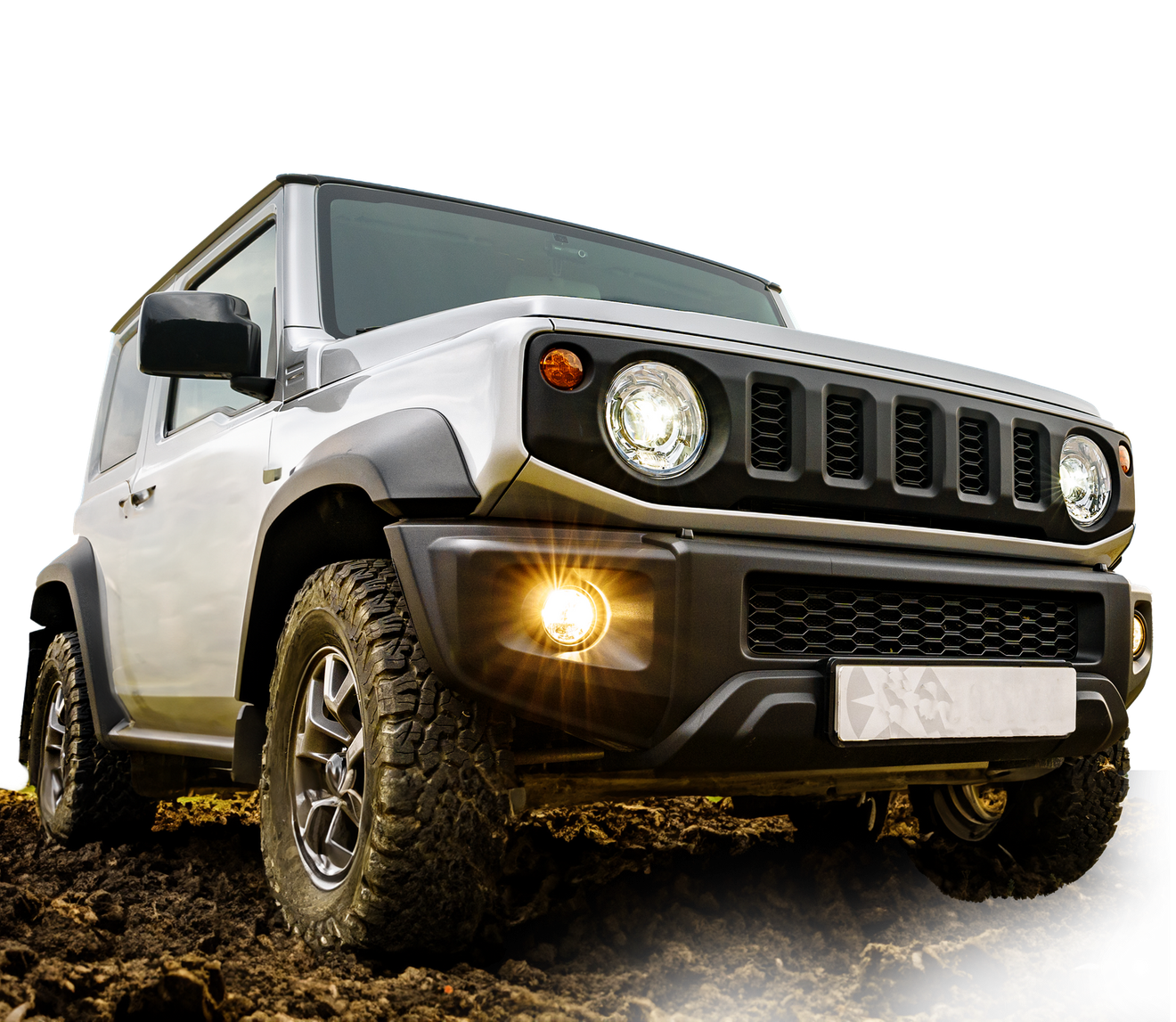 A jeep is driving through the mud on a white background.