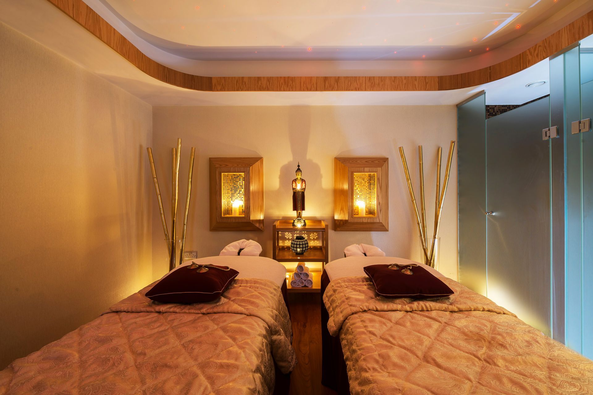 Asimina Suites Hotel A hotel room with two beds and a glass door