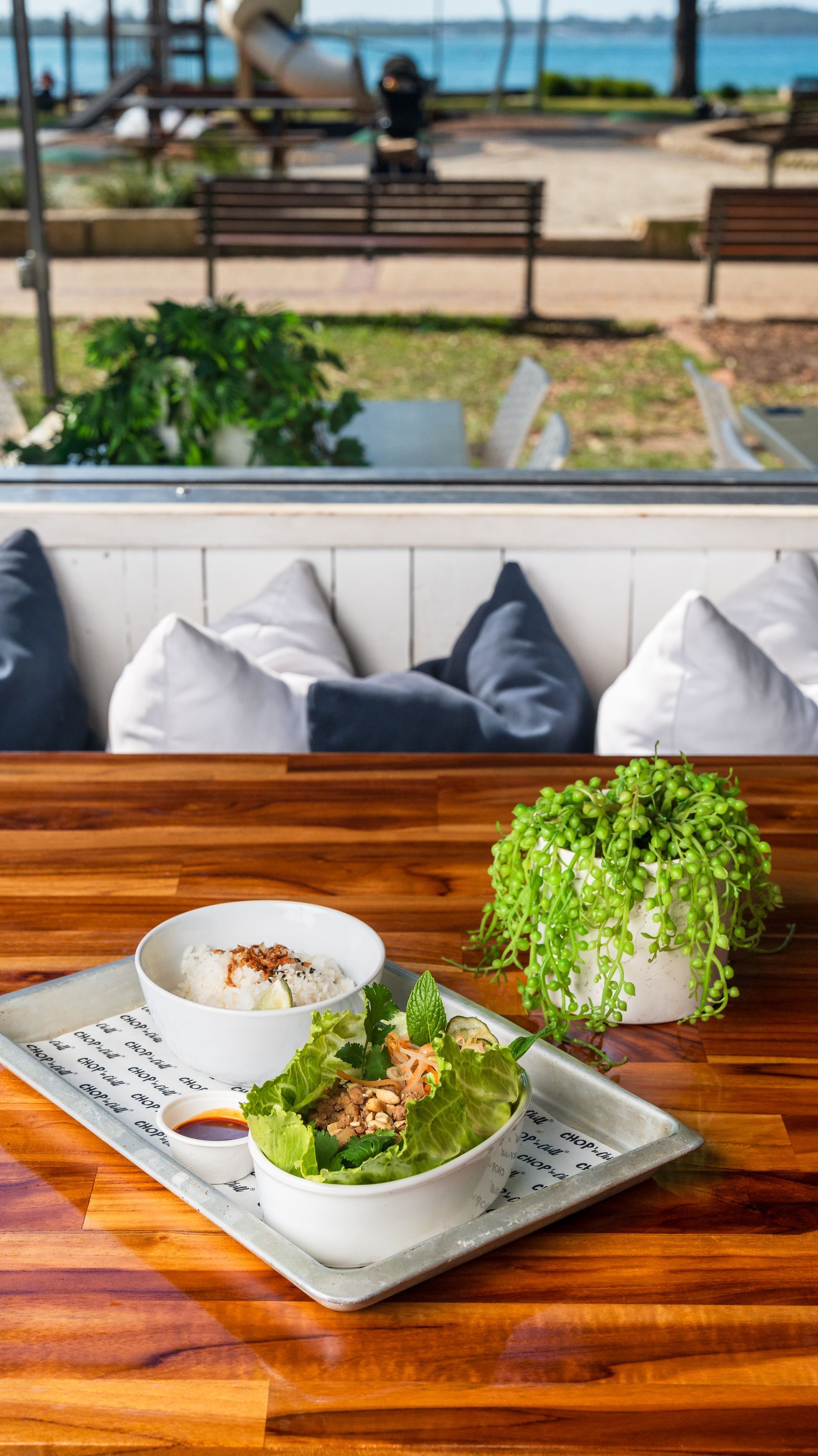 A Restaurant with Tables and Chairs in Front of It — Chop 'n Chill South West Rocks in South West Rocks, NSW