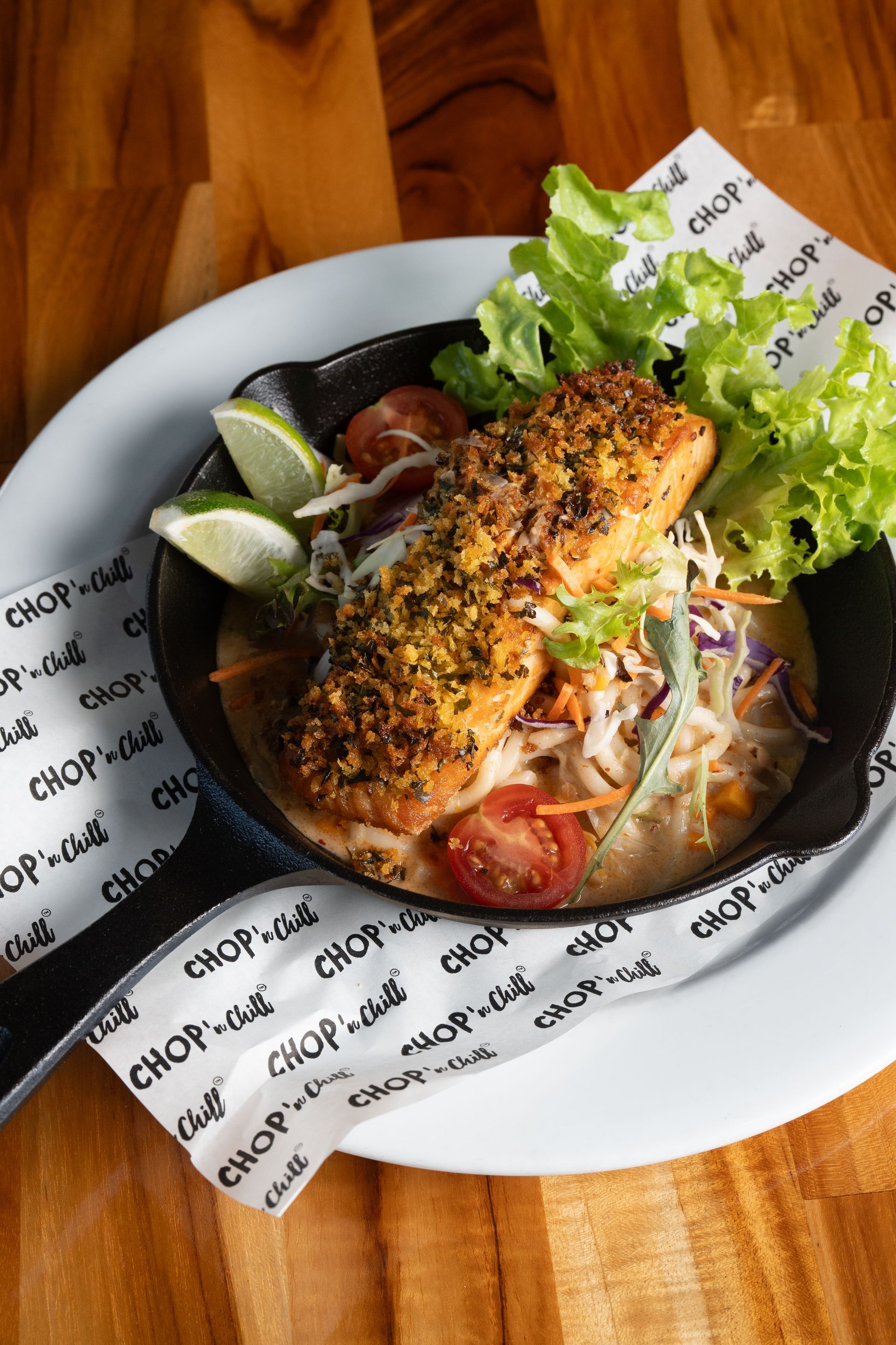 A White Plate Topped With a Bowl of Food on a Wooden Table — Chop 'n Chill South West Rocks in South West Rocks, NSW