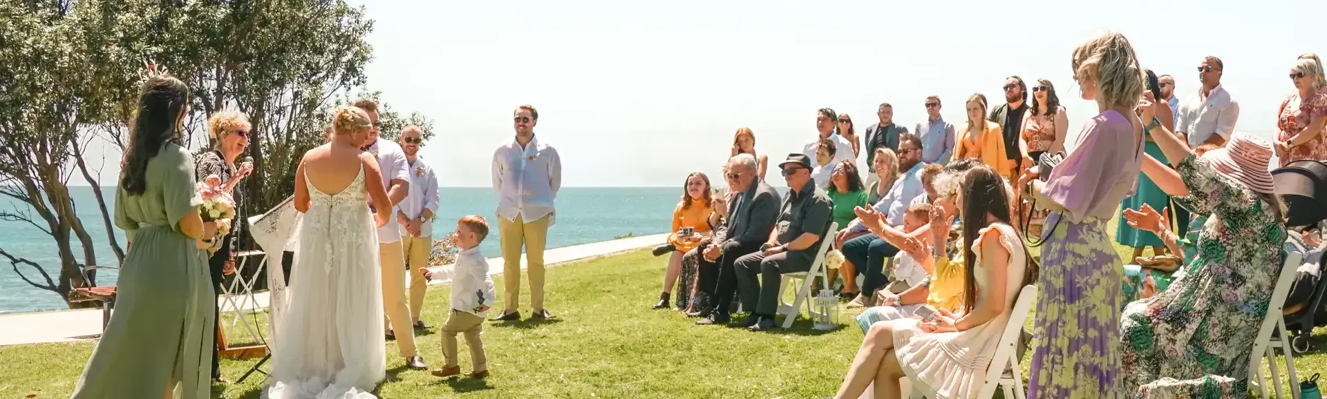 A Bride and Groom Are Getting Married in Front of A Crowd of People — Chop 'n Chill South West Rocks in South West Rocks, NSW