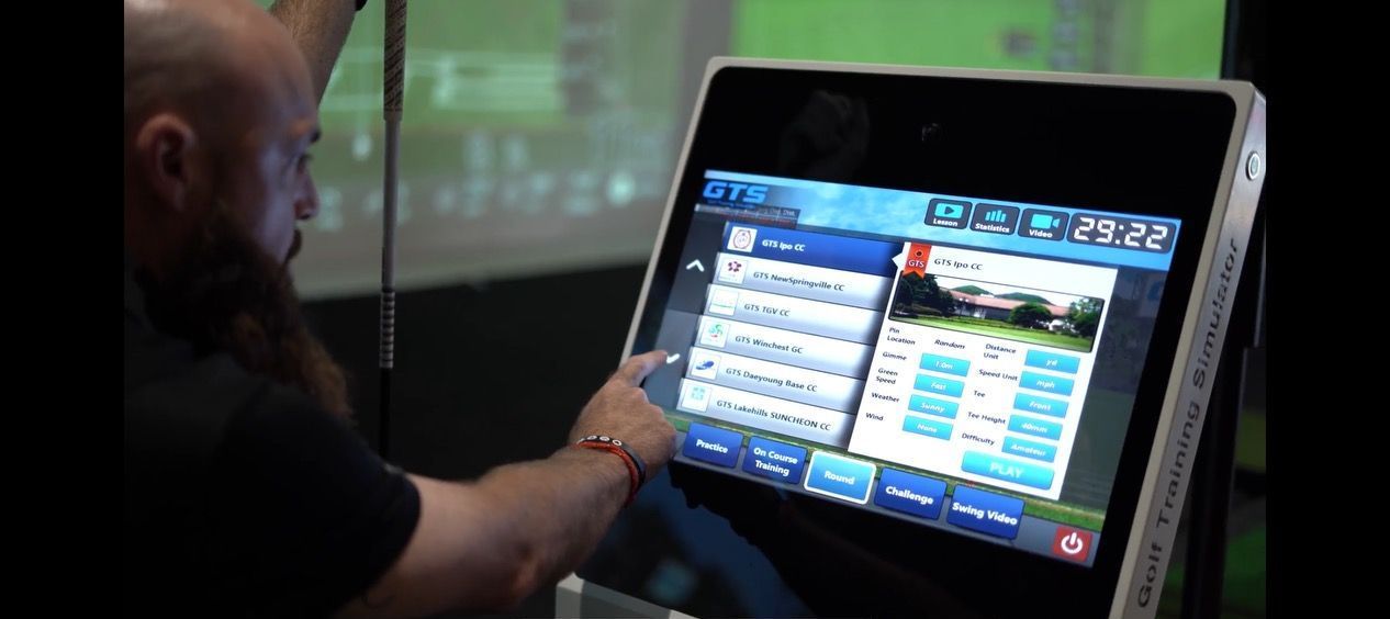 a man is using a golf training simulator