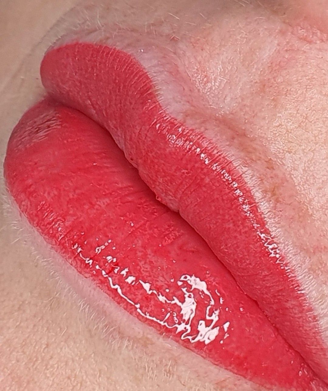 A Close-Up of Red Lips with A Glossy Sheen — Artisan Cosmetic Tattoo & Beauty in Worongary, QLD