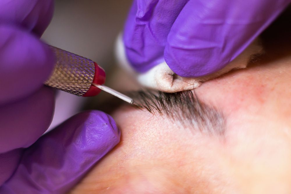 Eyebrow Microblading: Gloved Hands — Artisan Cosmetic Tattoo & Beauty in Worongary, QLD