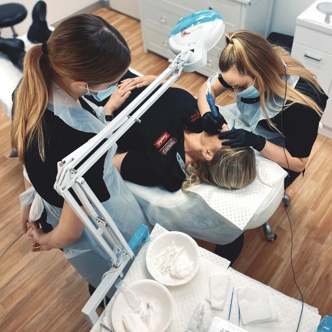 Three Technicians Performing Cosmetic Procedure — Artisan Cosmetic Tattoo & Beauty in Worongary, QLD