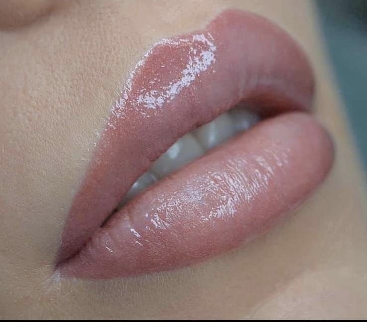 Close-up of Glossy, Nude-colored Lips — Artisan Cosmetic Tattoo & Beauty in Worongary, QLD