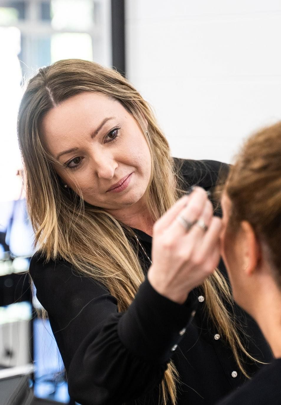 Woman Applying Makeup on Another Person's Face; Indoors  — Artisan Cosmetic Tattoo & Beauty in Worongary, QLD