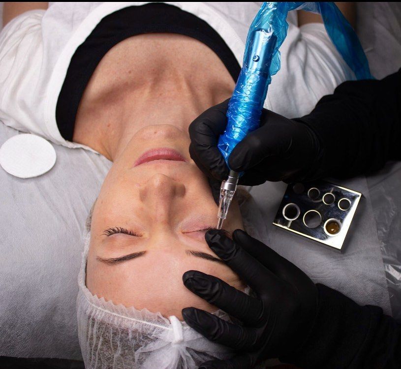 Person Receiving an Eyebrow Tattoo. Artist — Artisan Cosmetic Tattoo & Beauty in Worongary, QLD