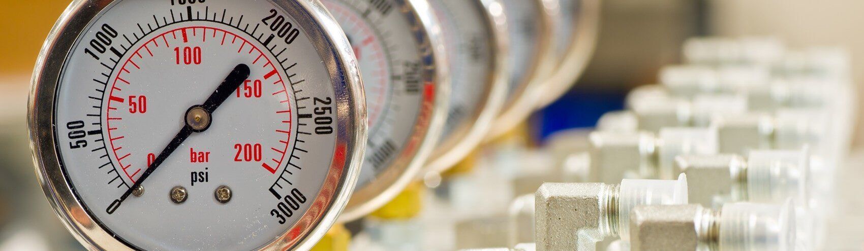 A Row of Pressure Gauges Are Sitting on Top of Each Other — Tony Brown Plumbing & Gas Services in South Grafton, NSW