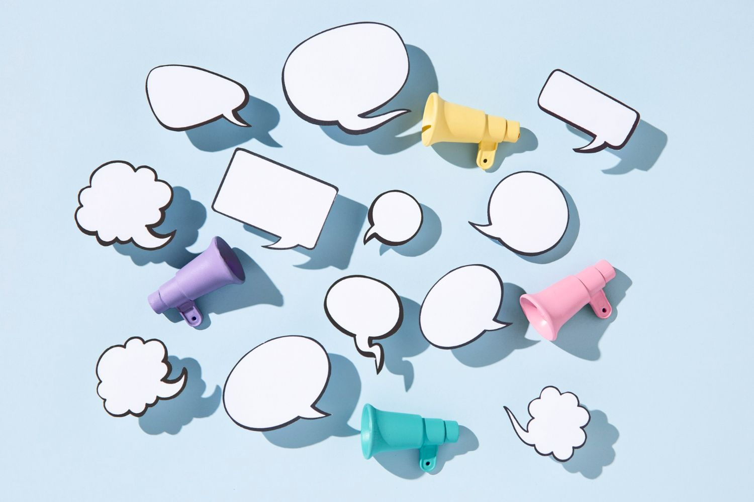 Image of chat bubbles coming out of megaphones in bright blues, purples, pinks, and yellows.