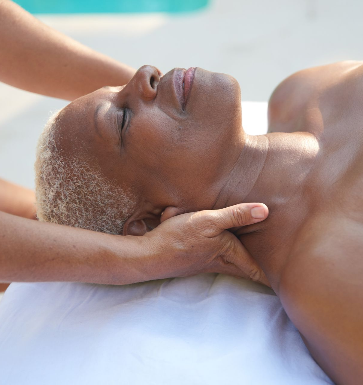 Facial treatment: a person's face being cleaned with a cotton pad by a professional in a spa setting. Facial treatment: a person's face being cleaned with a cotton pad by a professional in a spa setting.