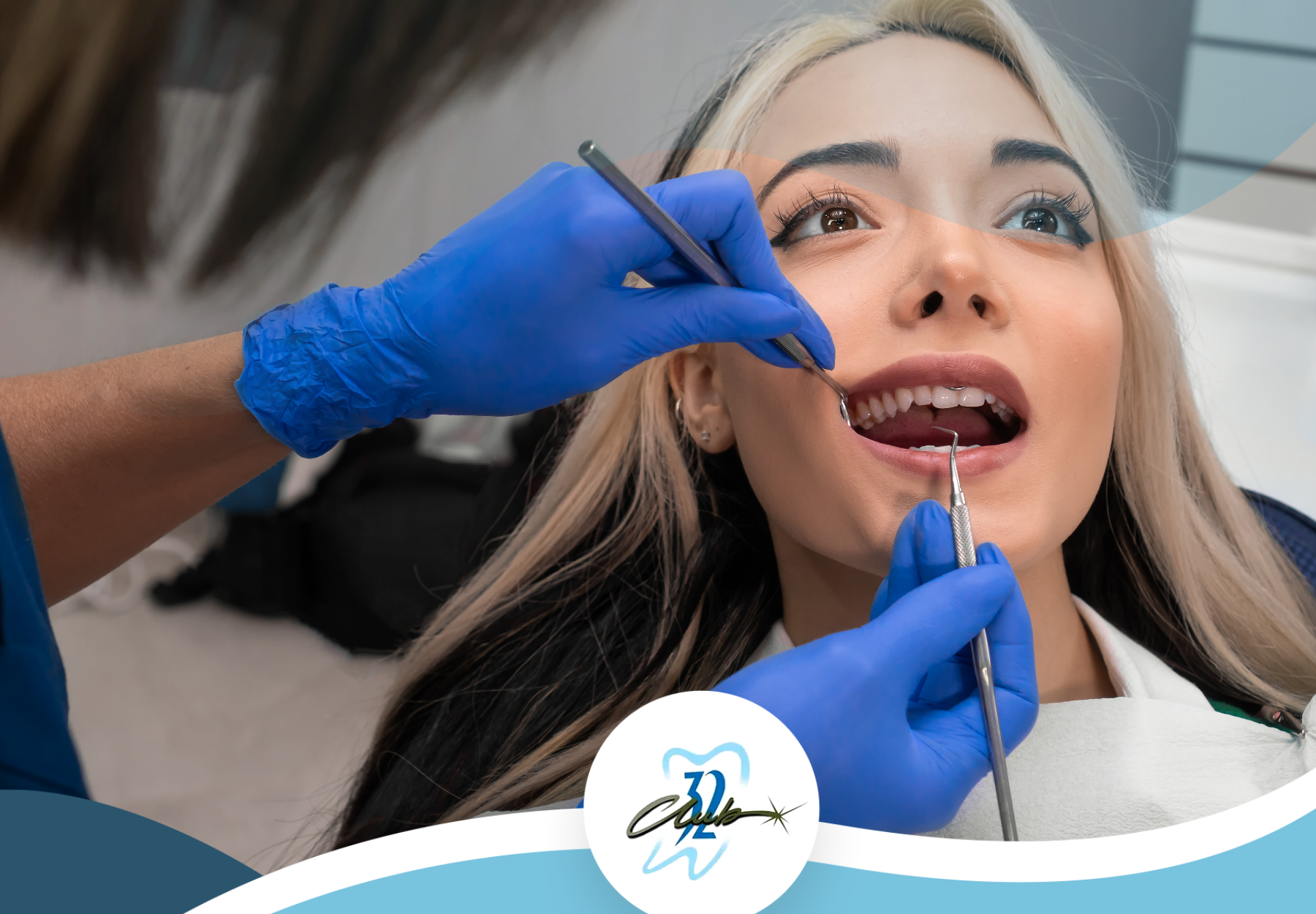 A woman is getting her teeth examined by a dentist.