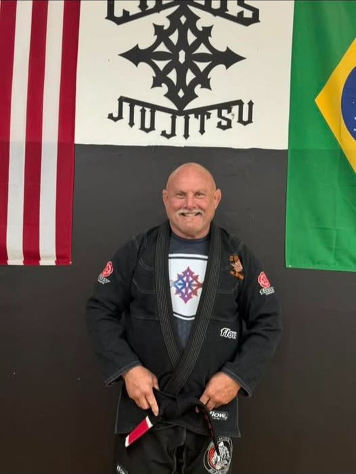 Man in a black Jiu-Jitsu.