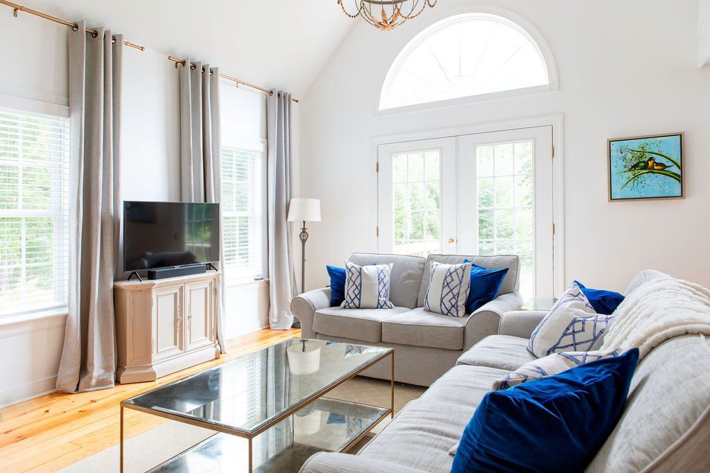 A living room filled with furniture and a flat screen tv.