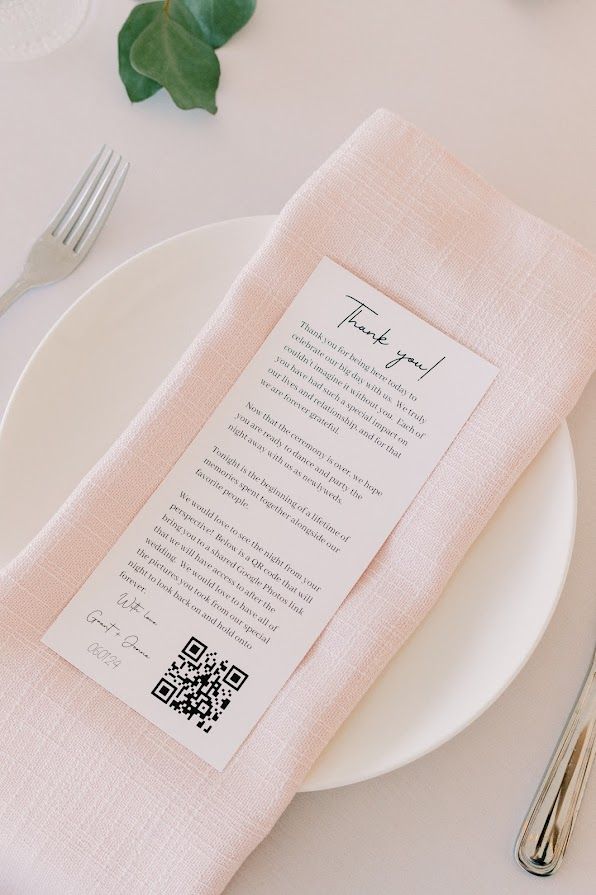 A napkin with a thank you card on it is sitting on a plate.
