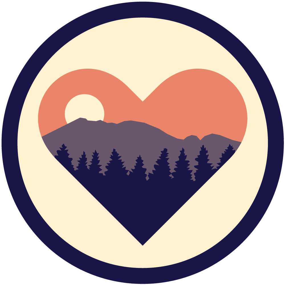 A heart with mountains and trees inside of it in a circle.
