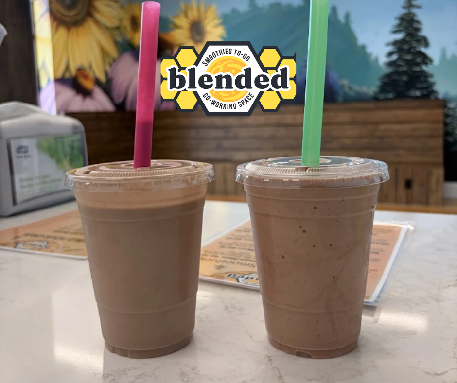 A group of people are sitting around a table for the Portland TBD networking meeting.