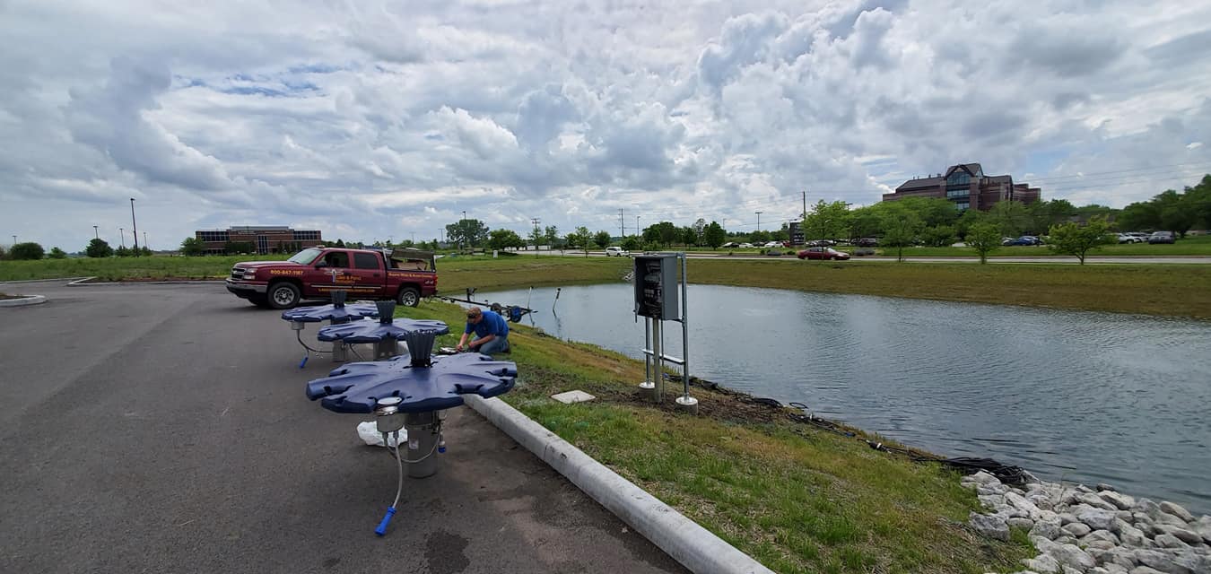 Men Doing Fountain Installation — Chesterton, IN — Lake & Pond Biologists LLC