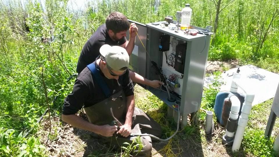 Men Checking the Machine — Chesterton, IN — Lake & Pond Biologists LLC
