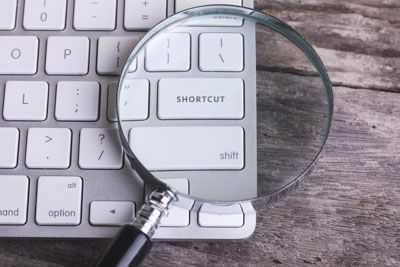 A magnifying glass over a keyboard shortcut key