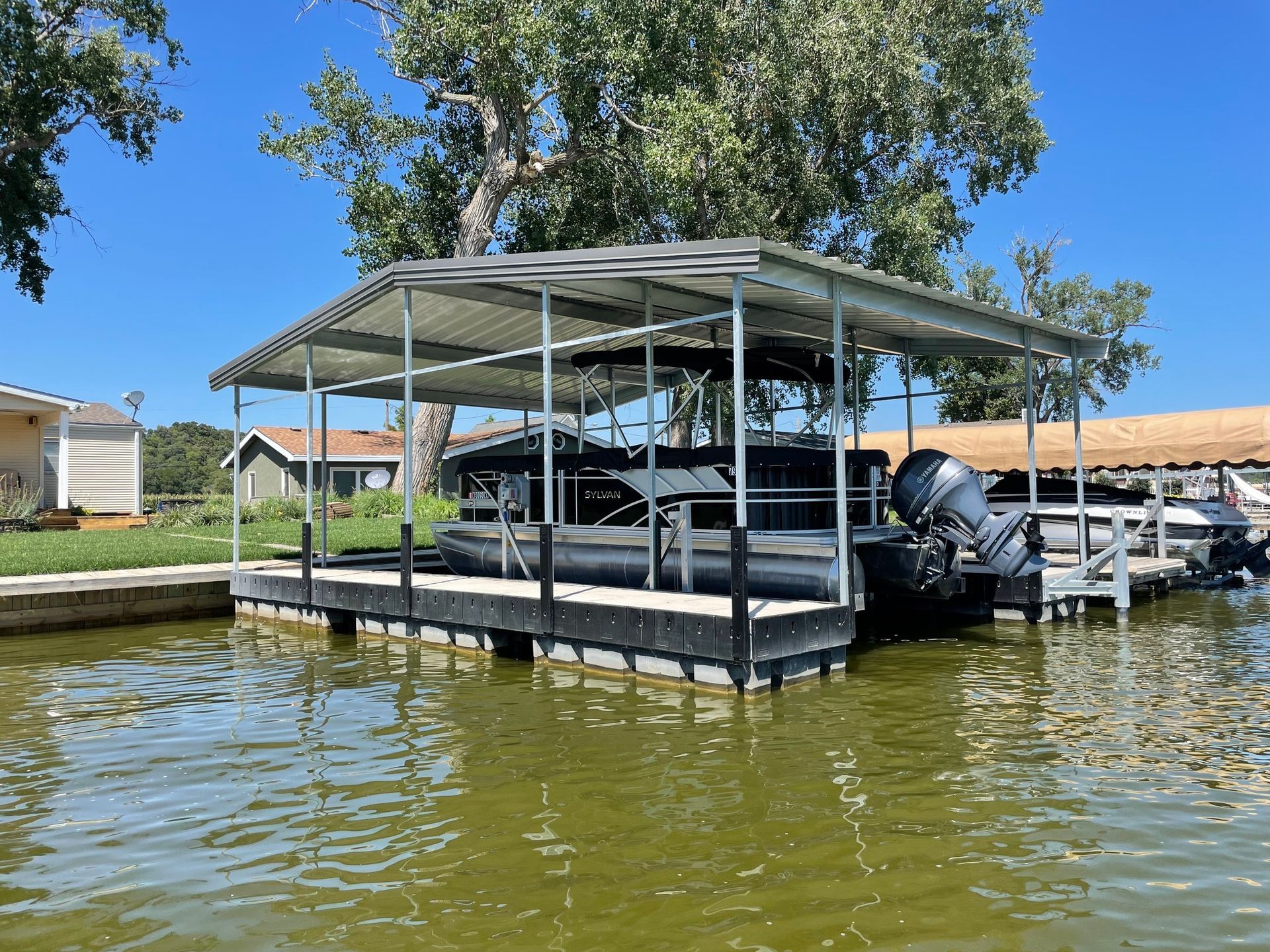 Build Your Dock, Boat Lifts & More in Lake Champetra, MO With Mac's Docks.