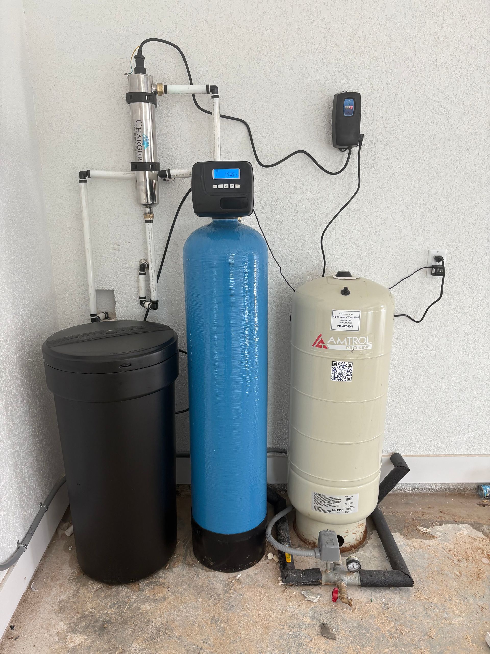 A close up of a row of blue pipes and valves