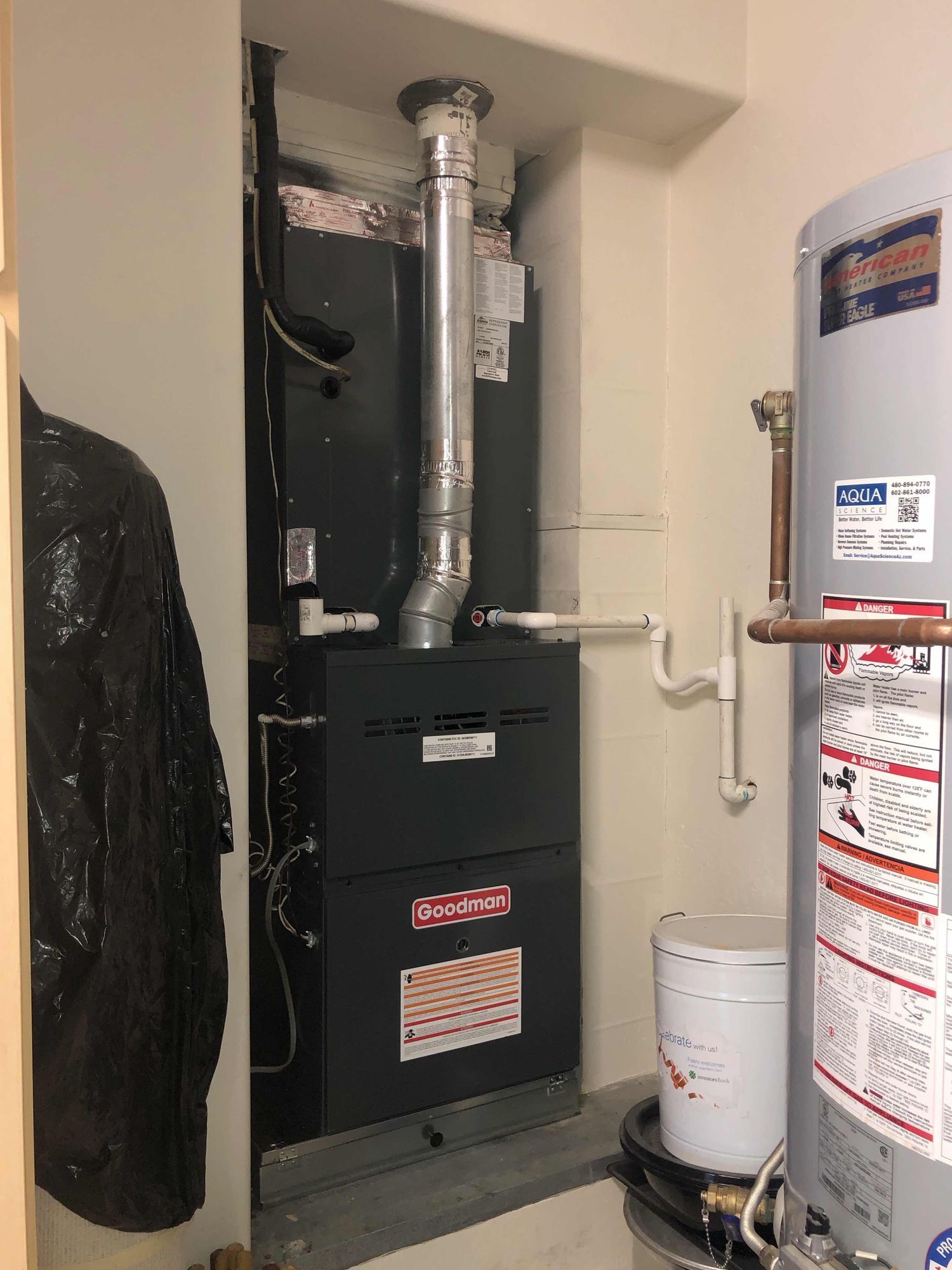 A room with a heater and a water heater in it