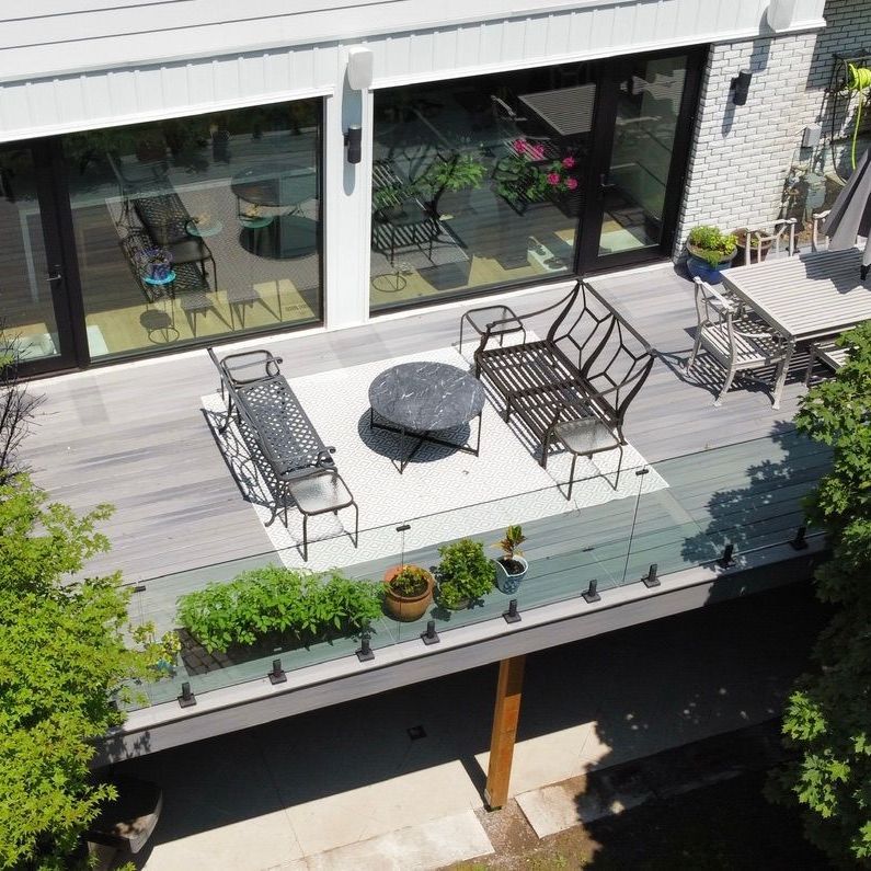 An aerial view of a deck with a table and chairs