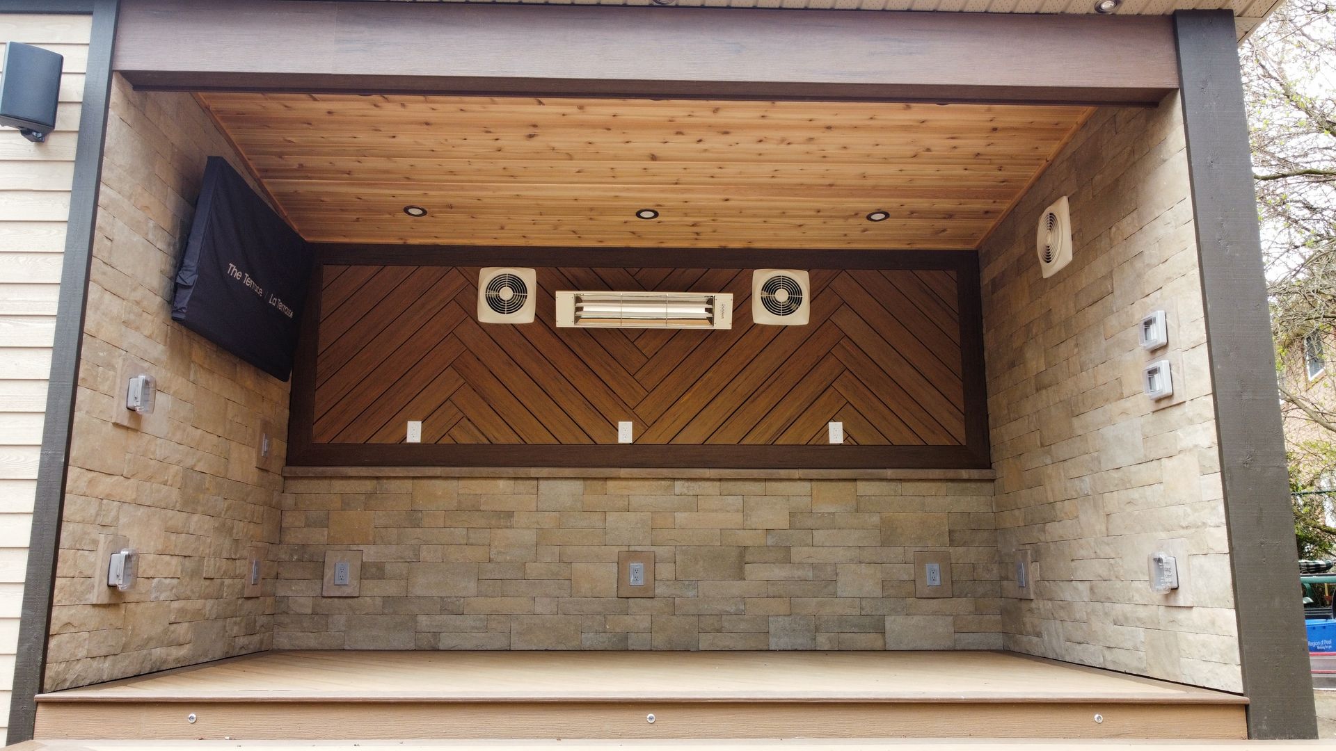 A wooden deck with lights on it is lit up at night.