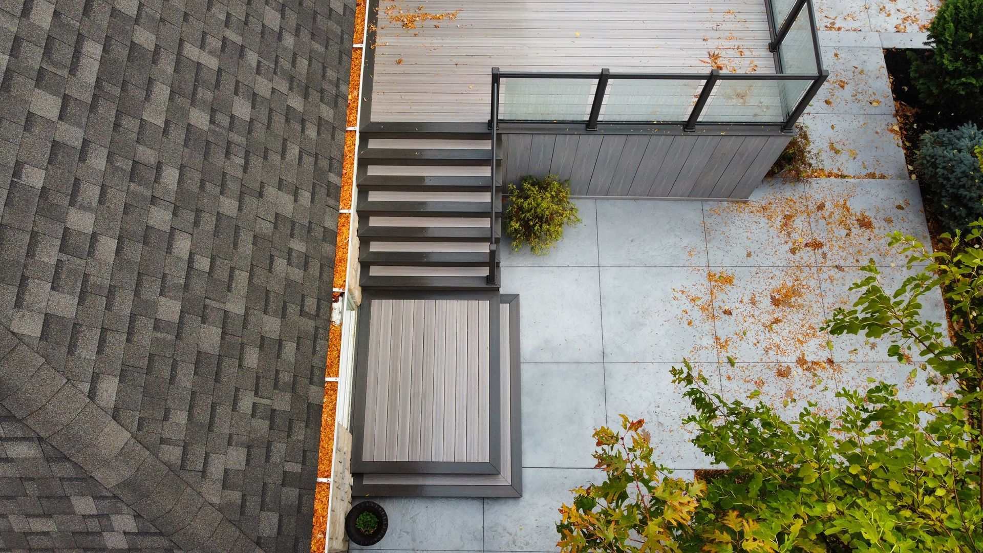 An aerial view of a deck with stairs and a roof.