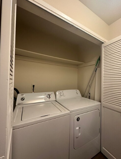 A laundry room with a washer and dryer in it