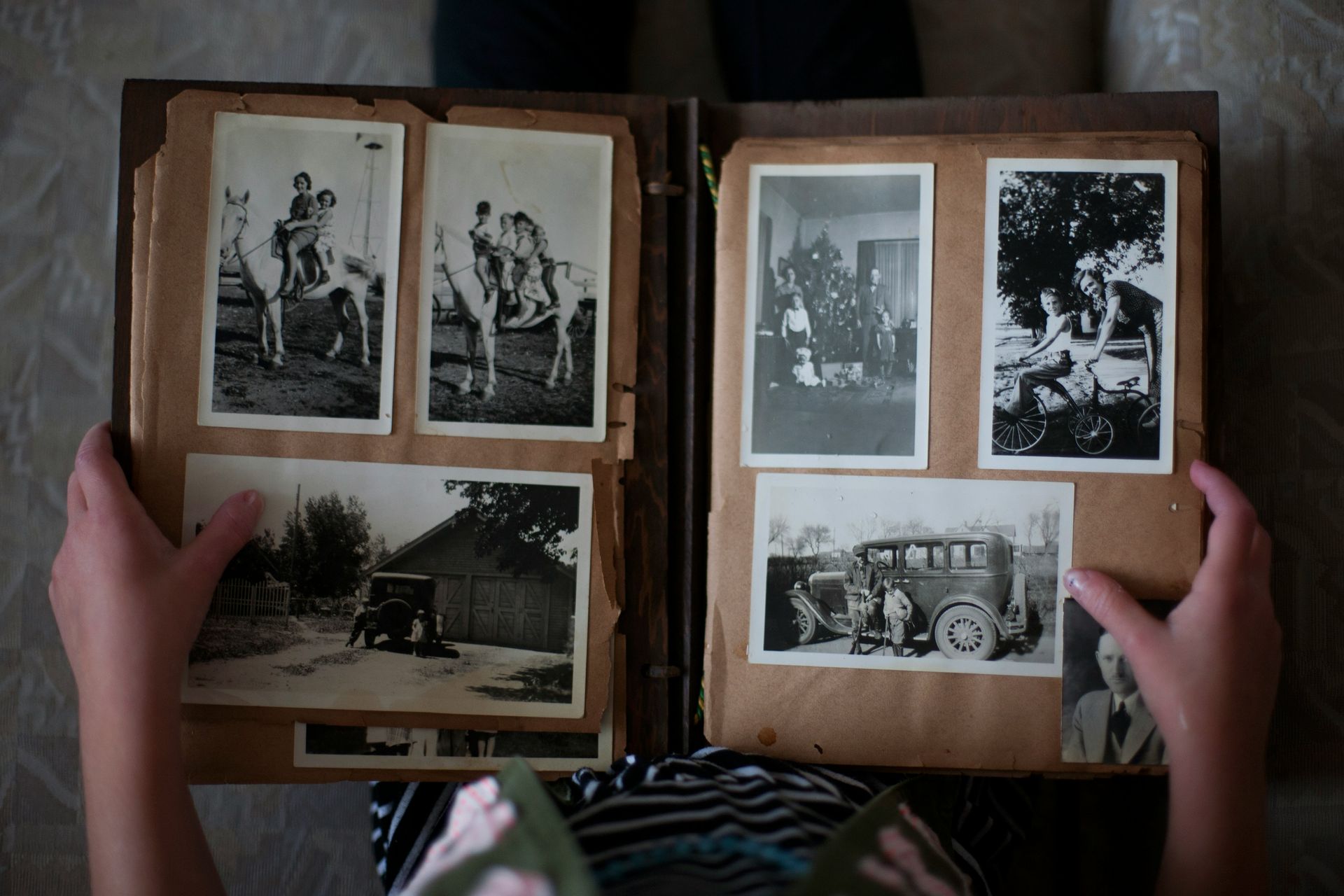 A book is open to a collage of children 's pictures