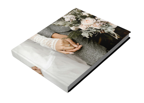 A book with a picture of a bride and groom holding hands.