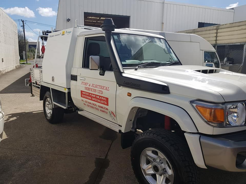 White utility truck in an industrial building