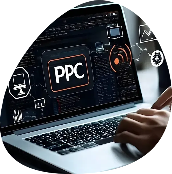 A person is typing on a laptop with a ppc logo on the screen.