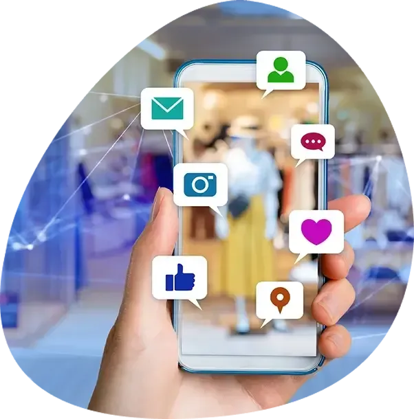 A person is holding a cell phone with social media icons on it