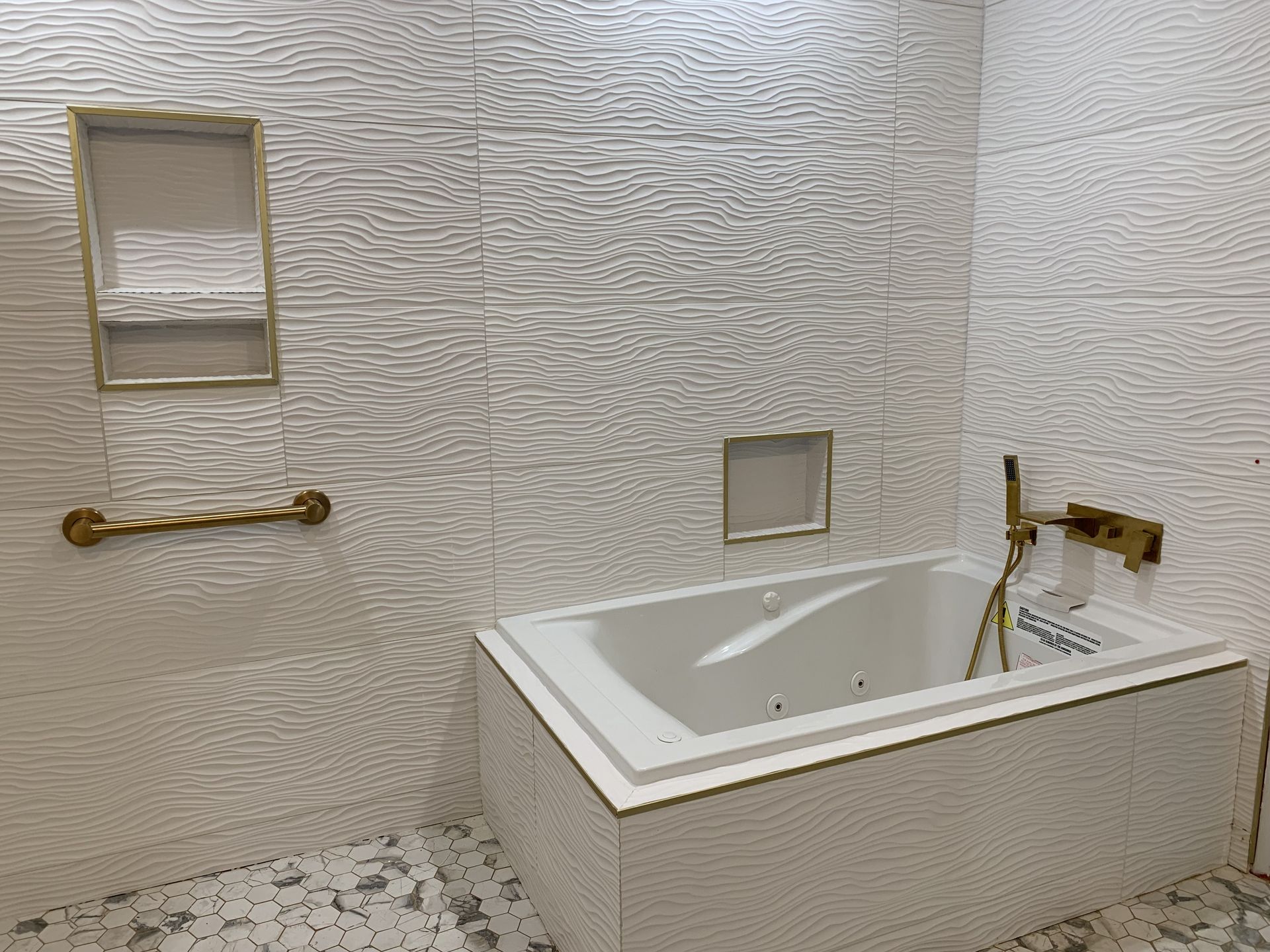 A bathroom with a bathtub and a shower.