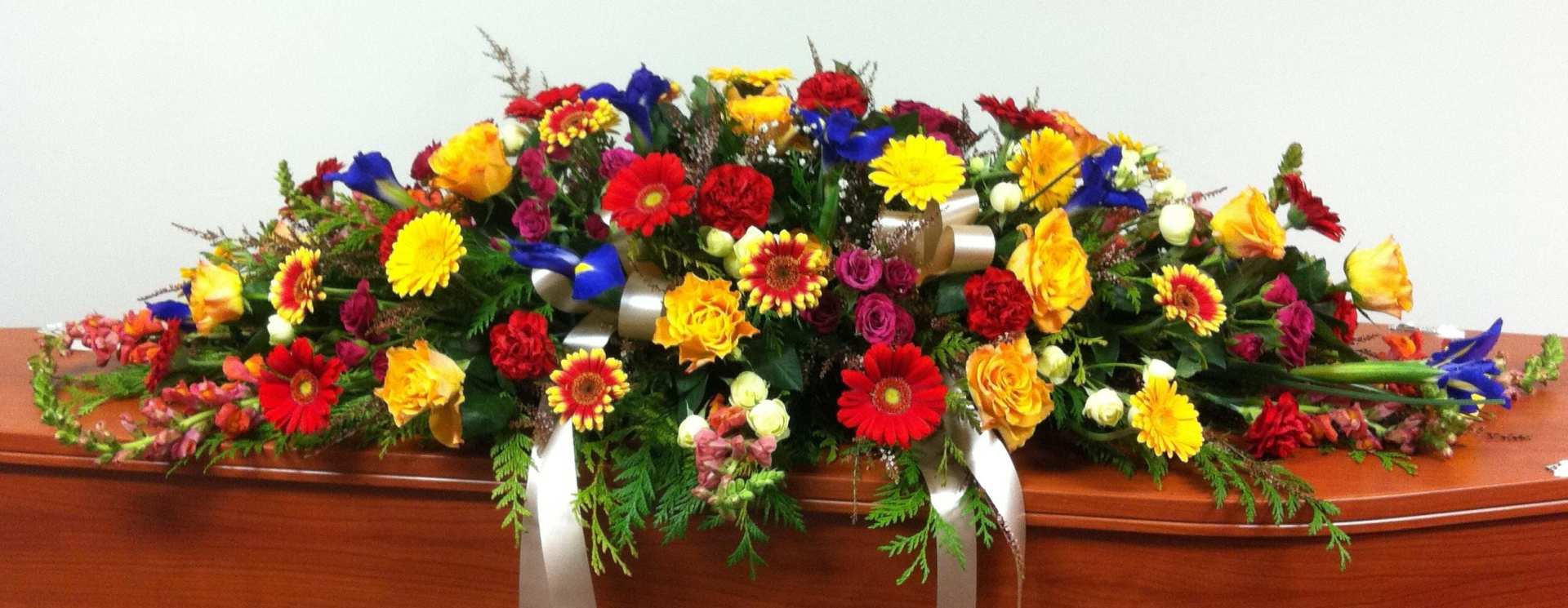 Bright Mixed Casket Spray – Funeral tributes in Rockhampton, QLD