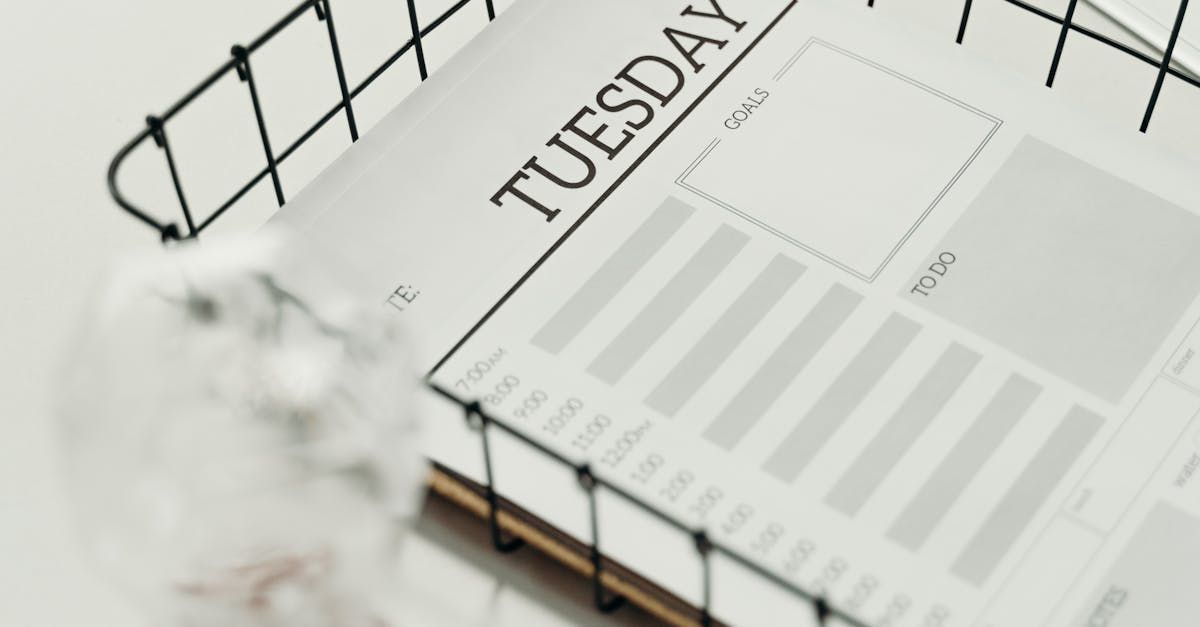 Wire in-basket with Calendar showing Tuesday as the day of the week.