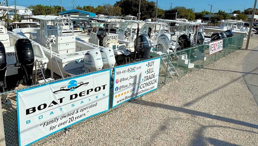 A boat depot with a lot of boats on display