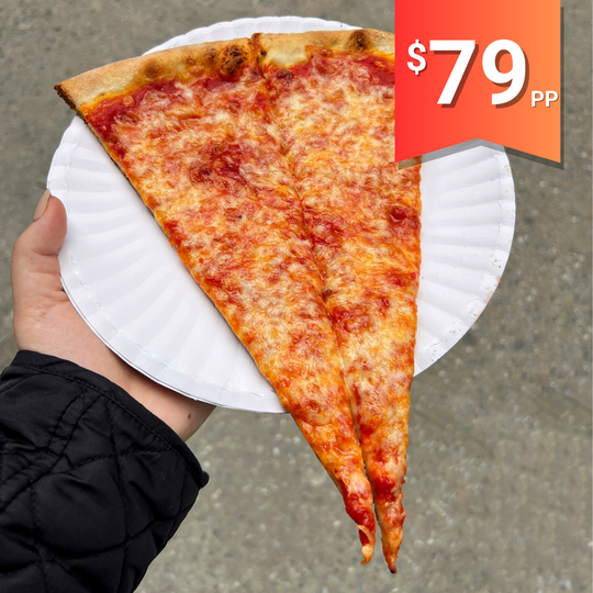 A slice of New York-style pepperoni pizza on a white plate.
