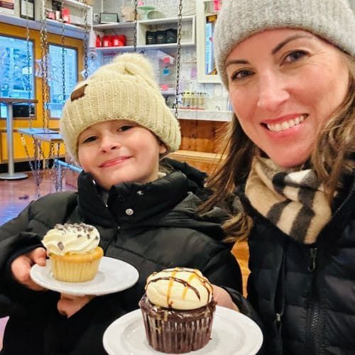 Mother and daughter enjoying a cupcake from Molly's Cupcakes, Greenwich Village NYC