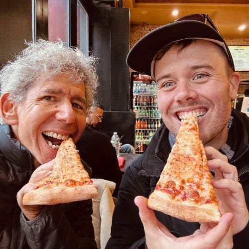 Food Tour Guide And Guest Eating Pizza in Greenwich Village NYC