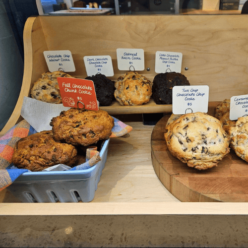 A cabinet containing different Levain Bakery cookies