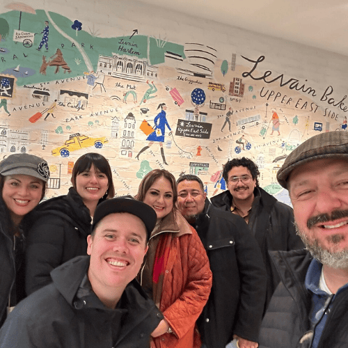 Tour guide Ryan with a family at Levain Bakery Upper East