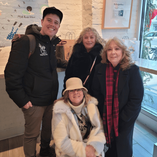 Tour guide Ryan with guests at Levain Bakery in New York City