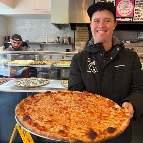 Tour Guide Ryan Holding a Cheese Pizza from Mimi's Pizza, Upper West Side