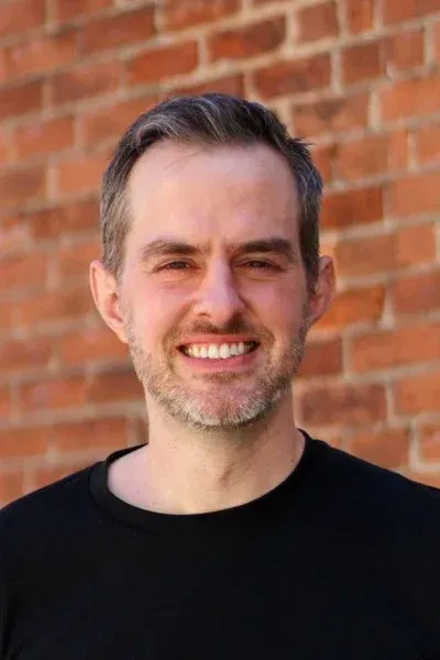 David Frasure headshot, tour guide at Tasty Tours NYC